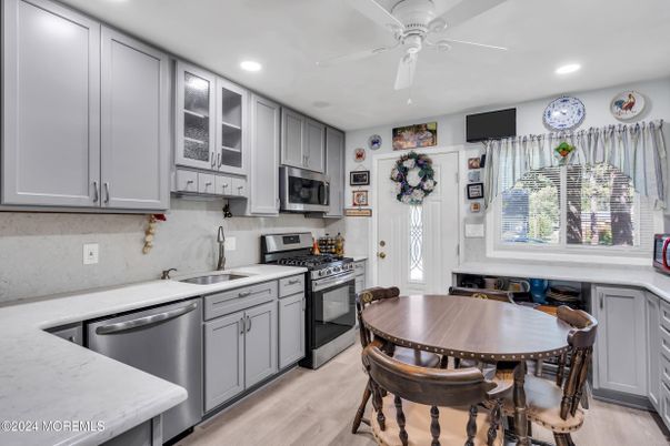 Dining room, Interior, Kitchen, Recessed Lighting, Stainless Steel Appliances, Wood Texture Flooring