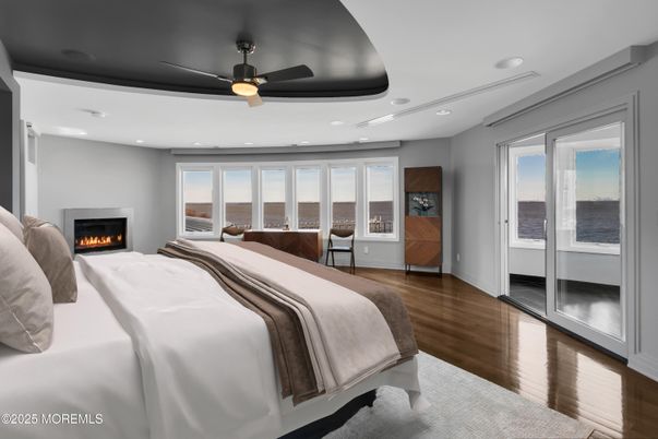 Bedroom, Fireplace, Interior, Recessed Lighting, Water, Wood Texture Flooring