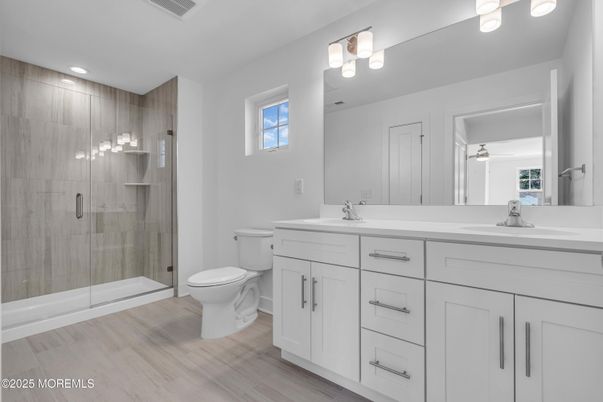 Bathroom, Dual Sink Vanities, Glass Shower, Interior, Recessed Lighting, Wood Texture Flooring
