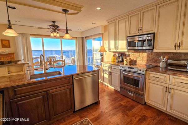 Interior, Kitchen, Pendant Lights, Recessed Lighting, Stainless Steel Appliances, Water, Wood Texture Flooring