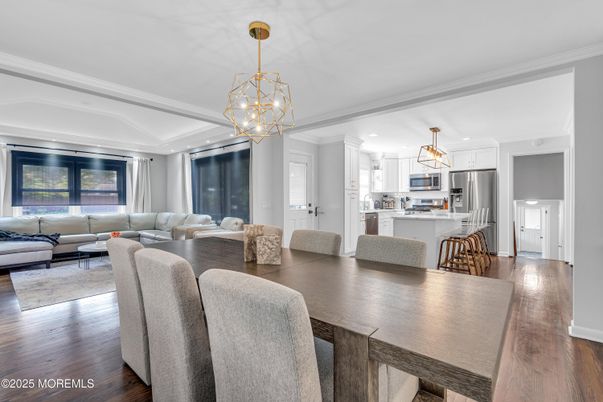 Chandelier, Dining room, Interior, Kitchen, Living room, Pendant Lights, Stainless Steel Appliances, Wood Texture Flooring