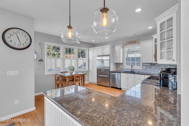 Dining room, Interior, Kitchen, Pendant Lights, Recessed Lighting, Stainless Steel Appliances, Wood Texture Flooring