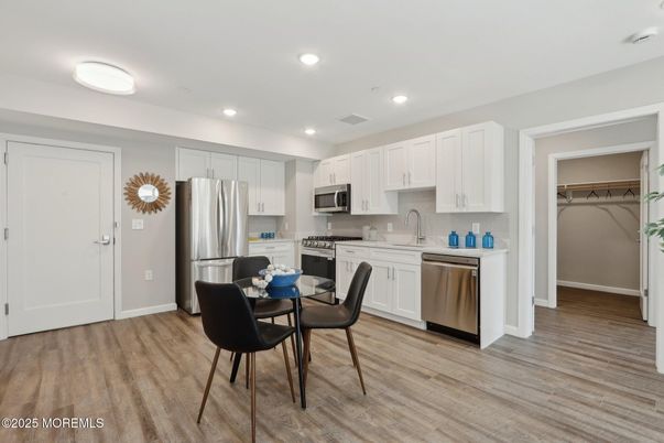 Dining room, Interior, Kitchen, Recessed Lighting, Stainless Steel Appliances, Wood Texture Flooring
