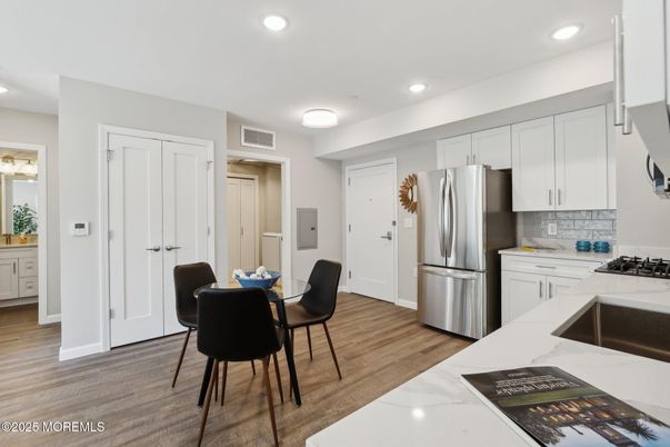 Dining room, Interior, Kitchen, Recessed Lighting, Stainless Steel Appliances, Wood Texture Flooring