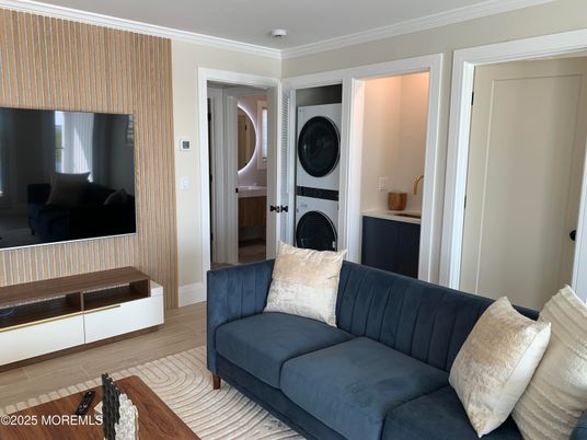 Interior, Living room, Utility Closets, Washer, Wood Texture Flooring