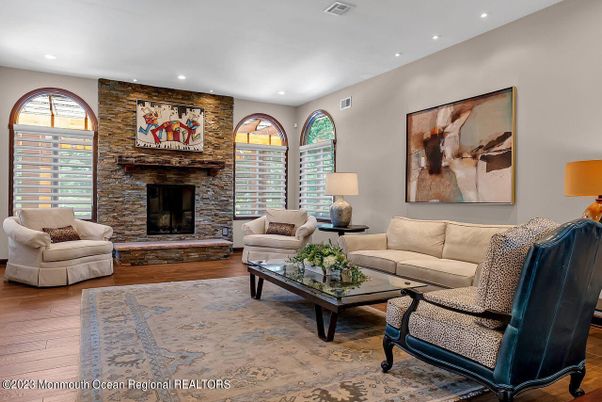 Fireplace, Interior, Living room, Recessed Lighting, Stone Walls, Wood Texture Flooring