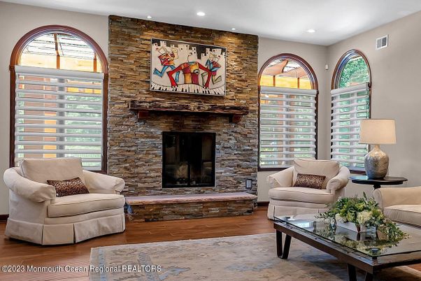 Fireplace, Interior, Living room, Recessed Lighting, Stone Walls, Wood Texture Flooring