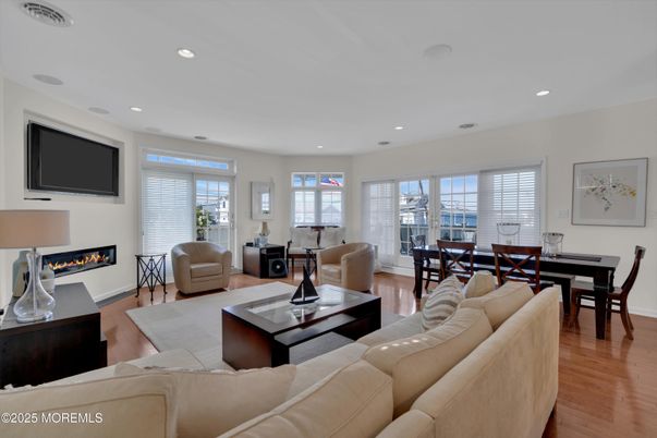 Dining room, Fireplace, Interior, Living room, Recessed Lighting, Wood Texture Flooring