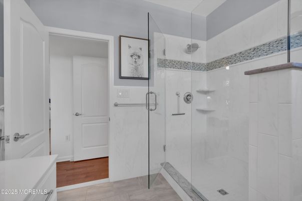 Bathroom, Glass Shower, Interior, Marble Walls, Wood Texture Flooring