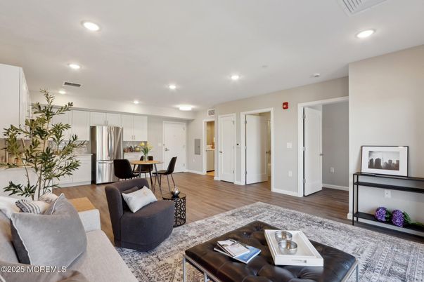Dining room, Interior, Kitchen, Living room, Recessed Lighting, Stainless Steel Appliances, Wood Texture Flooring