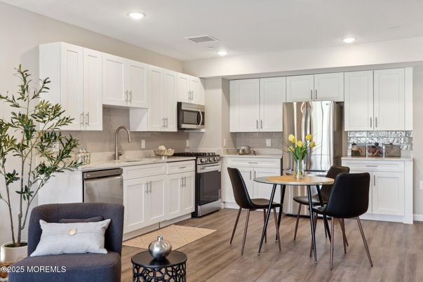 Dining room, Interior, Kitchen, Recessed Lighting, Stainless Steel Appliances, Wood Texture Flooring