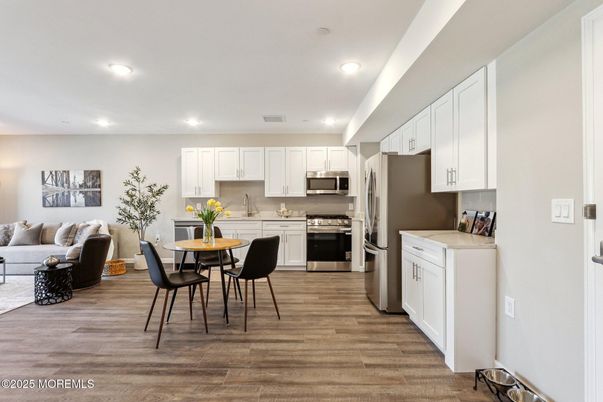 Dining room, Interior, Kitchen, Living room, Recessed Lighting, Stainless Steel Appliances, Wood Texture Flooring