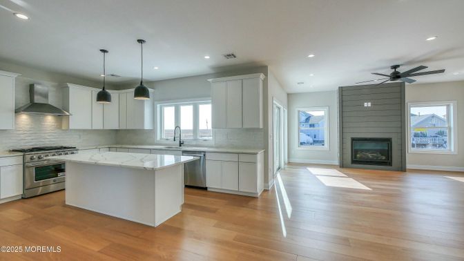 Fireplace, Interior, Kitchen, Pendant Lights, Recessed Lighting, Stainless Steel Appliances, Wood Texture Flooring