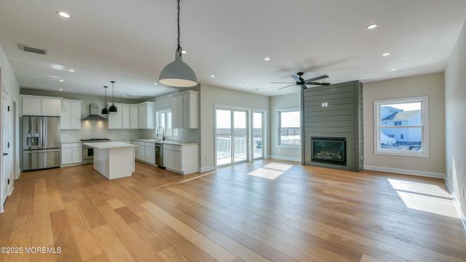 Fireplace, Interior, Kitchen, Pendant Lights, Recessed Lighting, Stainless Steel Appliances, Wood Texture Flooring