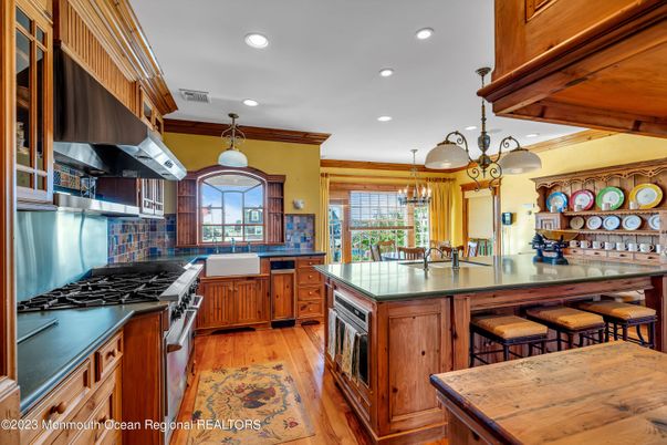Chandelier, Interior, Kitchen, Pendant Lights, Recessed Lighting, Stainless Steel Appliances, Wood Texture Flooring