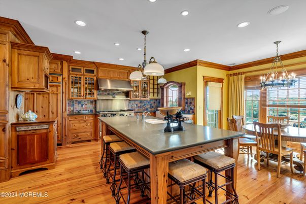 Chandelier, Dining room, Interior, Kitchen, Pendant Lights, Recessed Lighting, Stainless Steel Appliances, Wood Texture Flooring
