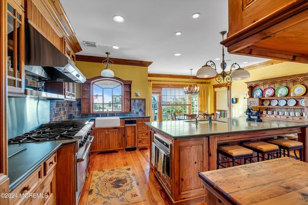 Chandelier, Interior, Kitchen, Pendant Lights, Recessed Lighting, Stainless Steel Appliances, Wood Texture Flooring
