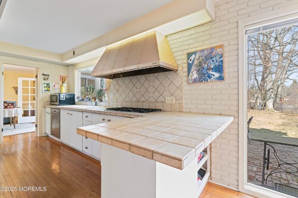 Interior, Kitchen, Stone Walls, Tile Countertops, Wood Texture Flooring