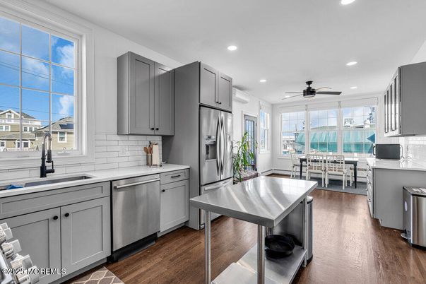 Dining room, Interior, Kitchen, Recessed Lighting, Stainless Steel Appliances, Wood Texture Flooring