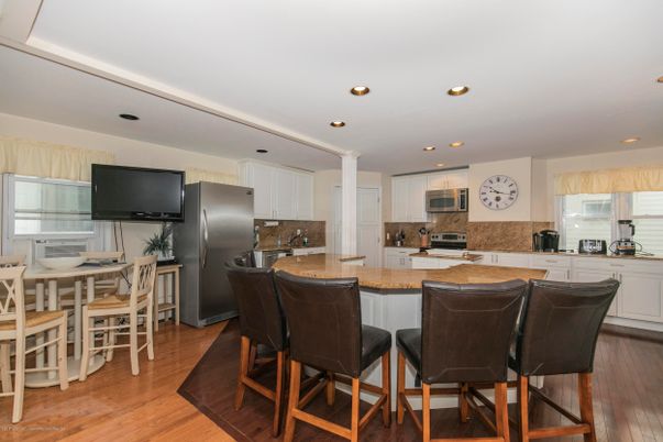 Dining room, Interior, Kitchen, Recessed Lighting, Stainless Steel Appliances, Wood Texture Flooring