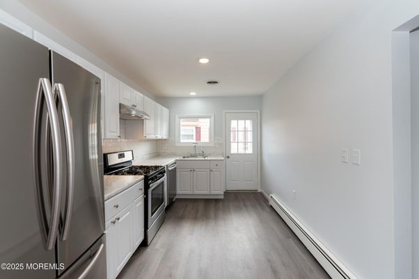Interior, Kitchen, Recessed Lighting, Stainless Steel Appliances, Wood Texture Flooring