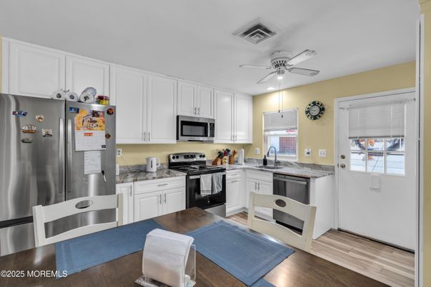 Interior, Kitchen, Recessed Lighting, Stainless Steel Appliances, Wood Texture Flooring