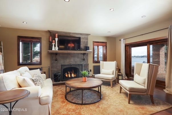 Fireplace, Interior, Living room, Recessed Lighting, Water, Wood Texture Flooring