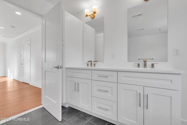 Bathroom, Dual Sink Vanities, Interior, Recessed Lighting, Wood Texture Flooring