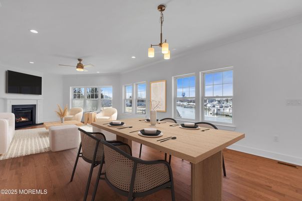 Dining room, Fireplace, Interior, Living room, Pendant Lights, Recessed Lighting, Wood Texture Flooring