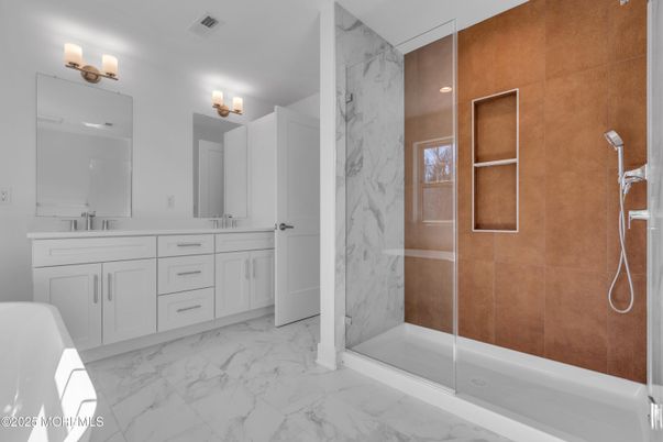 Bathroom, Dual Sink Vanities, Glass Shower, Interior, Marble, Marble Walls, Recessed Lighting