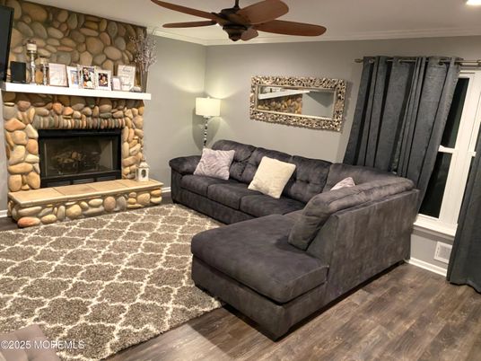 Fireplace, Interior, Living room, Recessed Lighting, Stone Walls, Wood Texture Flooring