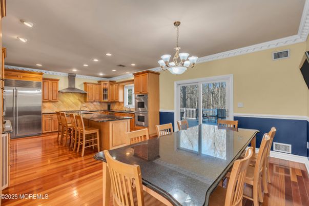 Chandelier, Dining room, Interior, Kitchen, Recessed Lighting, Stainless Steel Appliances, Wood Texture Flooring