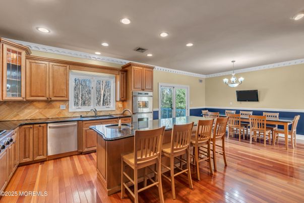Chandelier, Dining room, Interior, Kitchen, Recessed Lighting, Stainless Steel Appliances, Wood Texture Flooring