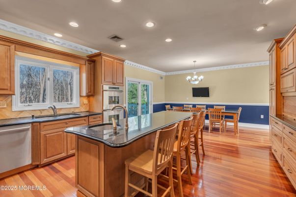 Chandelier, Dining room, Interior, Kitchen, Recessed Lighting, Stainless Steel Appliances, Wood Texture Flooring