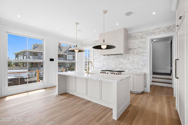 Interior, Kitchen, Marble Walls, Pendant Lights, Recessed Lighting, Wood Texture Flooring