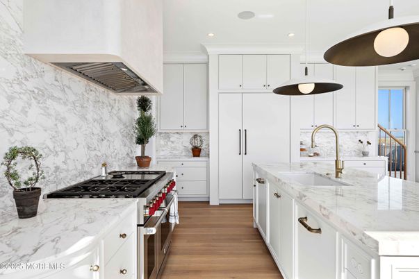Interior, Kitchen, Marble Walls, Pendant Lights, Recessed Lighting, Stainless Steel Appliances, Wood Texture Flooring