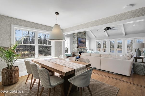Dining room, Fireplace, Interior, Living room, Recessed Lighting, Stone Walls, Wood Texture Flooring