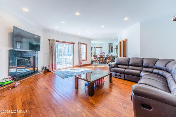 Dining room, Fireplace, Interior, Living room, Recessed Lighting, Wood Texture Flooring