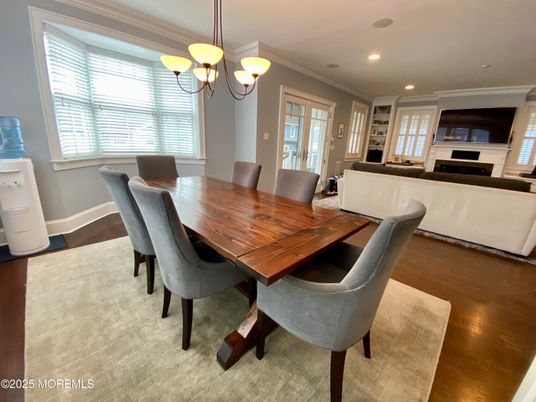 Chandelier, Dining room, Fireplace, Interior, Living room, Pendant Lights, Recessed Lighting, Wood Texture Flooring