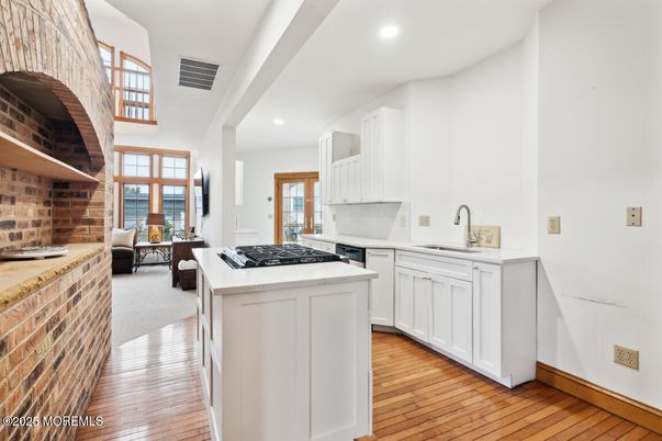 Interior, Kitchen, Recessed Lighting, Stone Walls, Wood Texture Flooring