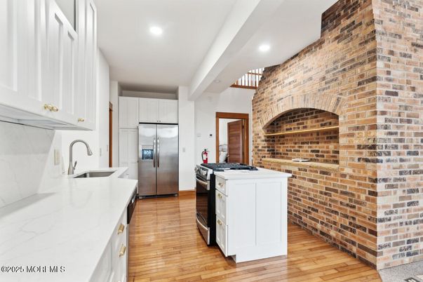 Interior, Kitchen, Recessed Lighting, Stainless Steel Appliances, Stone Walls, Wood Texture Flooring