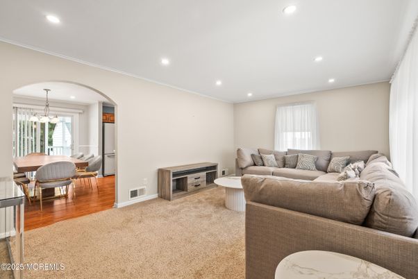 Dining room, Fireplace, Interior, Living room, Pendant Lights, Recessed Lighting, Wood Texture Flooring