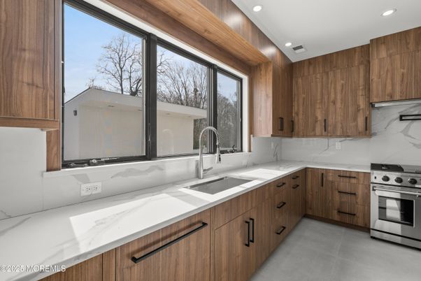 Interior, Kitchen, Marble Walls, Recessed Lighting, Stainless Steel Appliances