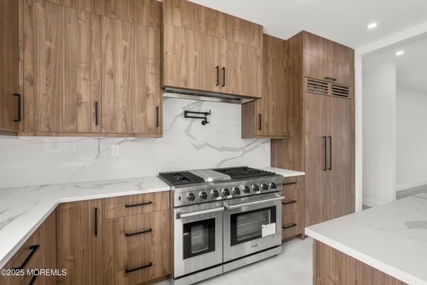 Interior, Kitchen, Marble Walls, Recessed Lighting, Stainless Steel Appliances