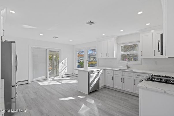 Interior, Kitchen, Recessed Lighting, Stainless Steel Appliances, Wood Texture Flooring