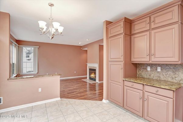 Chandelier, Empty room, Fireplace, Interior, Recessed Lighting, Wood Texture Flooring