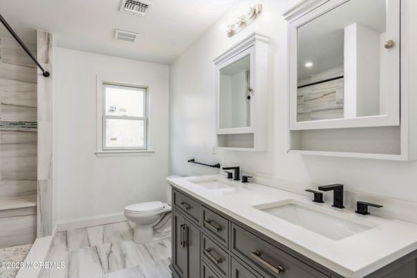Bathroom, Dual Sink Vanities, Interior, Marble, Recessed Lighting, Wood Texture Flooring