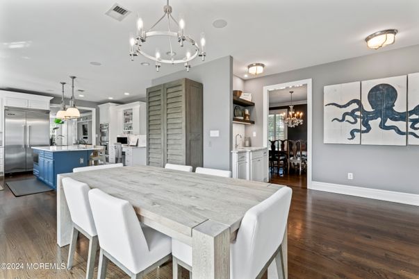Chandelier, Dining room, Interior, Kitchen, Pendant Lights, Recessed Lighting, Stainless Steel Appliances, Wood Texture Flooring