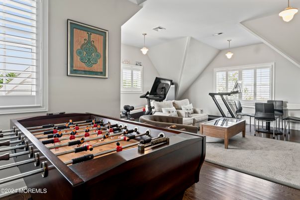 Billiard Table, Fitness Equipment, Game Room, Interior, Pendant Lights, Wood Texture Flooring