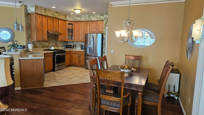 Dining room, Interior, Kitchen, Pendant Lights, Recessed Lighting, Stainless Steel Appliances, Wood Texture Flooring